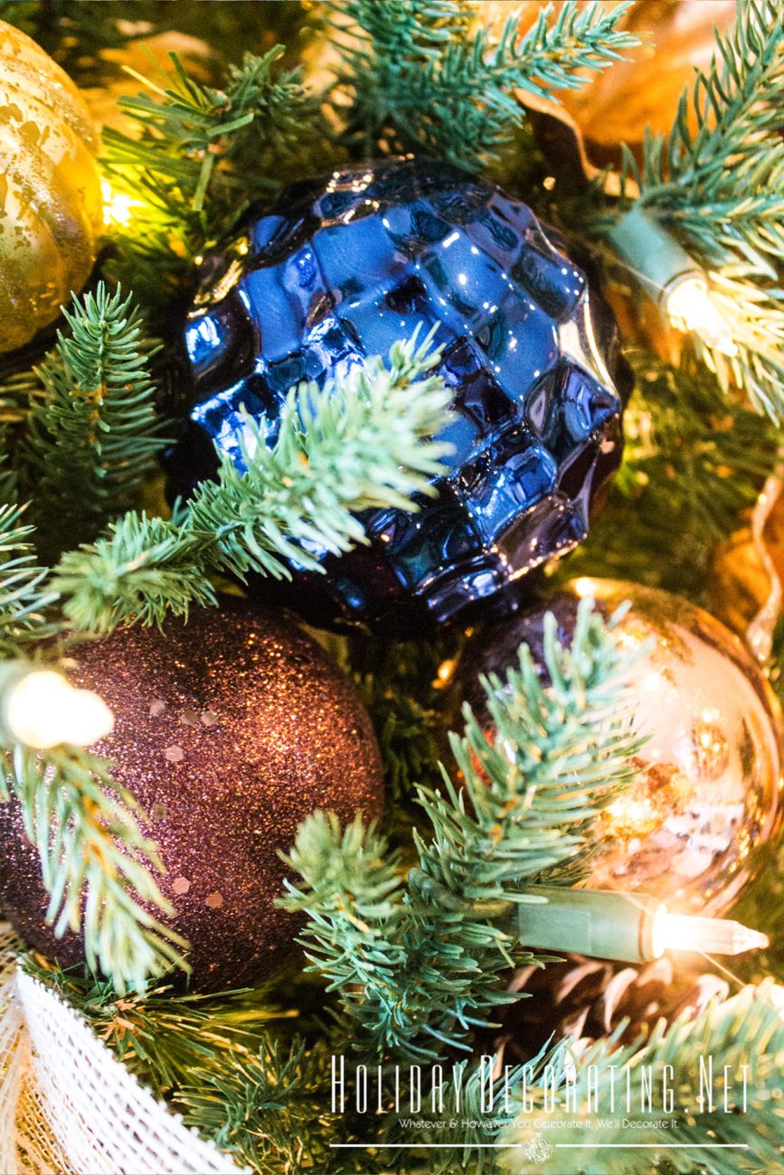 Navy, Brown & Rose Gold Christmas Ornaments Close-Up On Tree